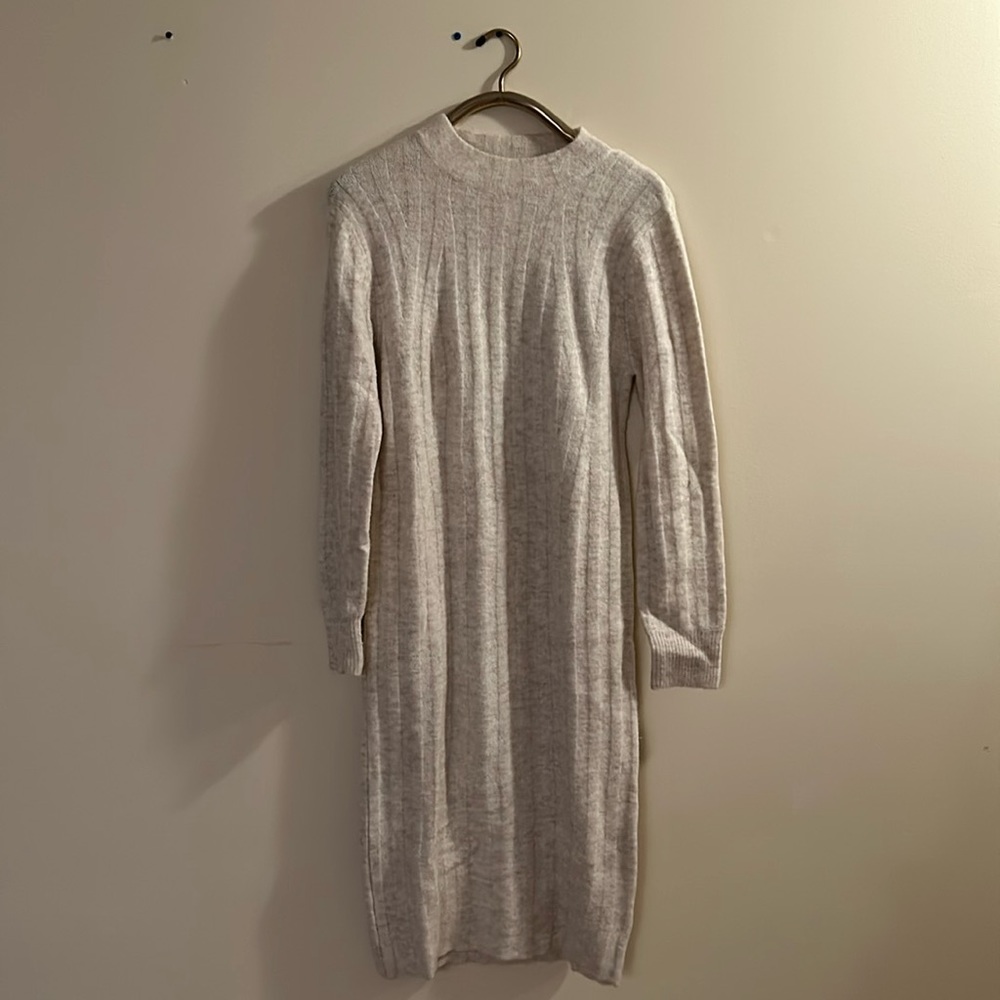 Super cute long sweater dress. This is adorable with long or chunky boots!